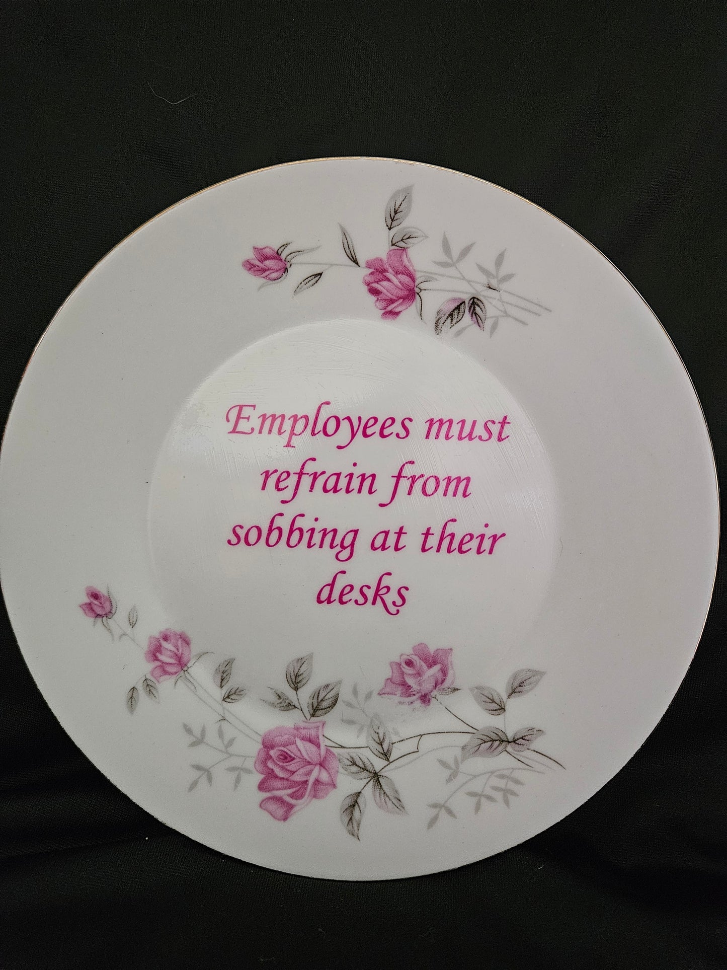 Employees must refrain from sobbing at their desks plate