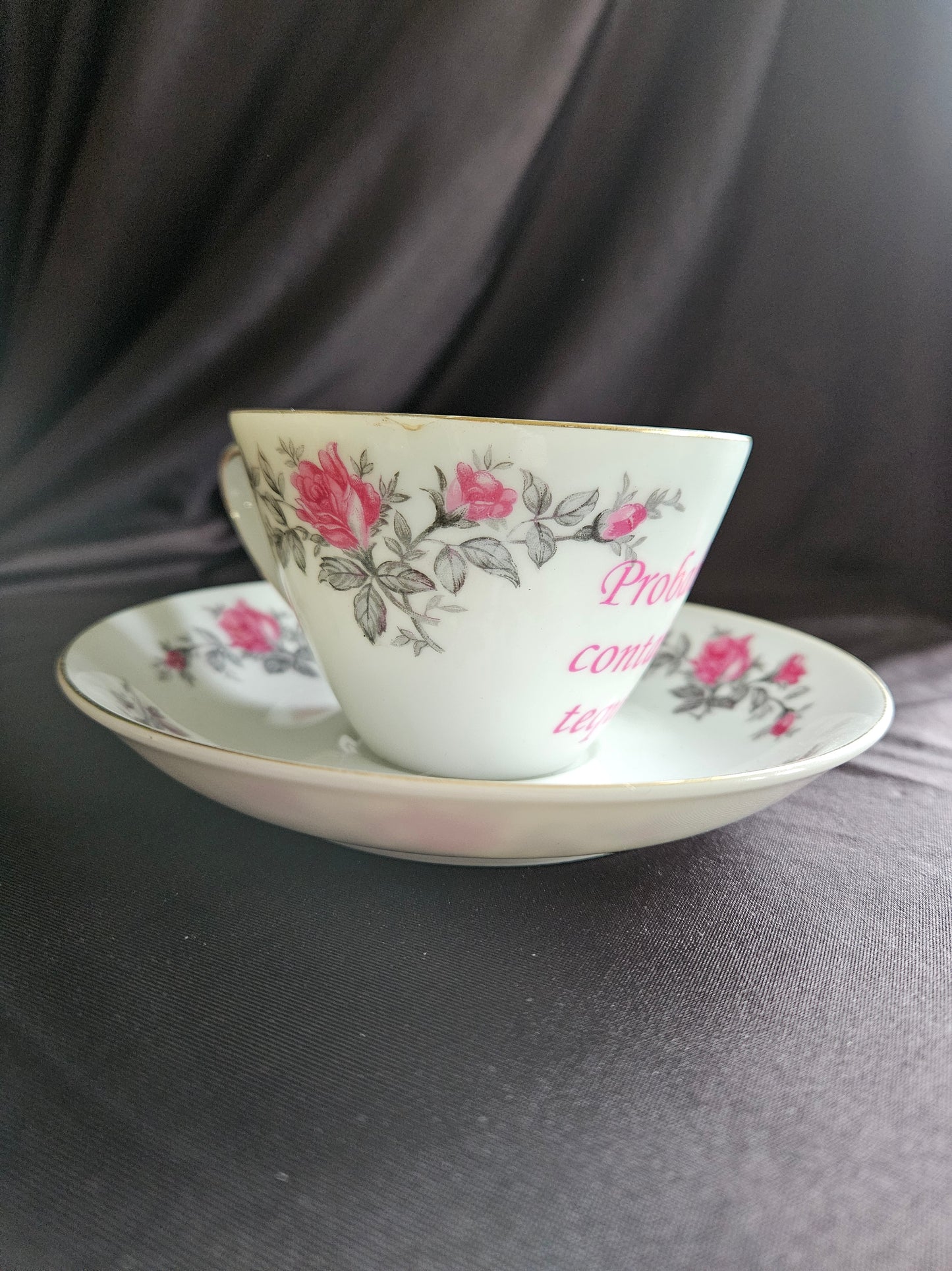 Probably contains Tequila teacup and saucer