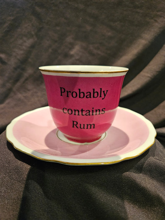Probably contains Rum Teacup and Saucer