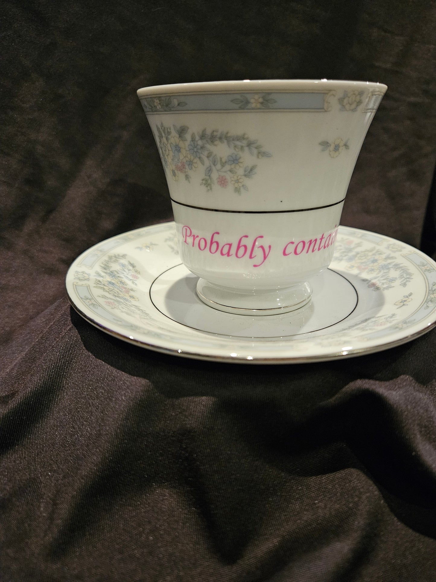 Probably contains Vodka teacup and saucer