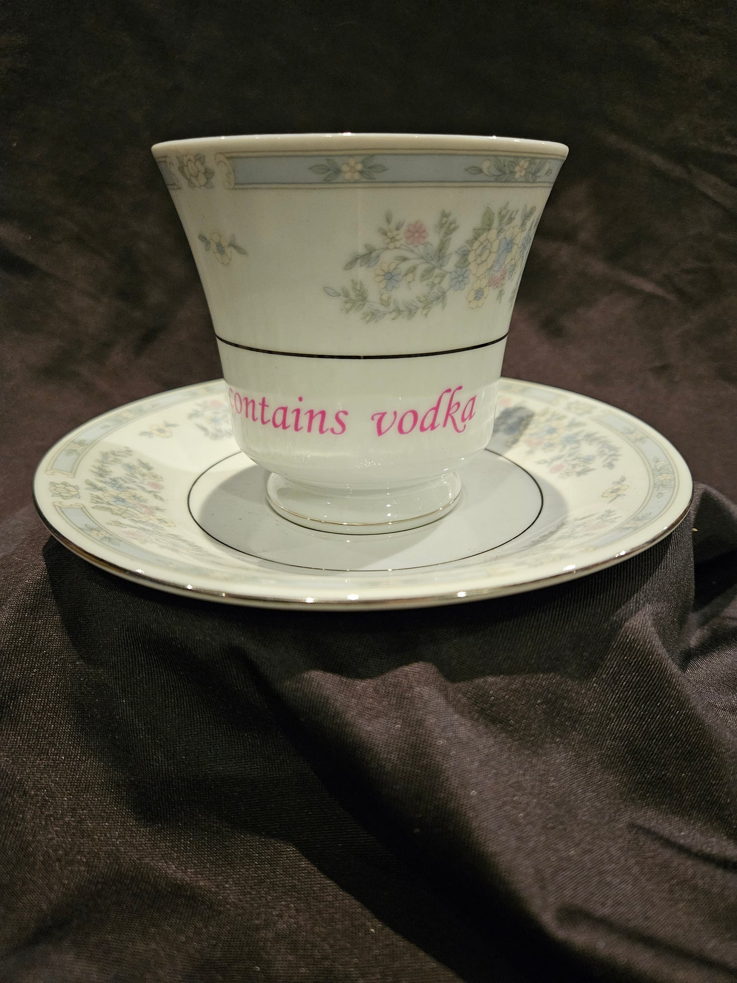 Probably contains Vodka teacup and saucer