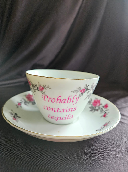 Probably contains Tequila teacup and saucer