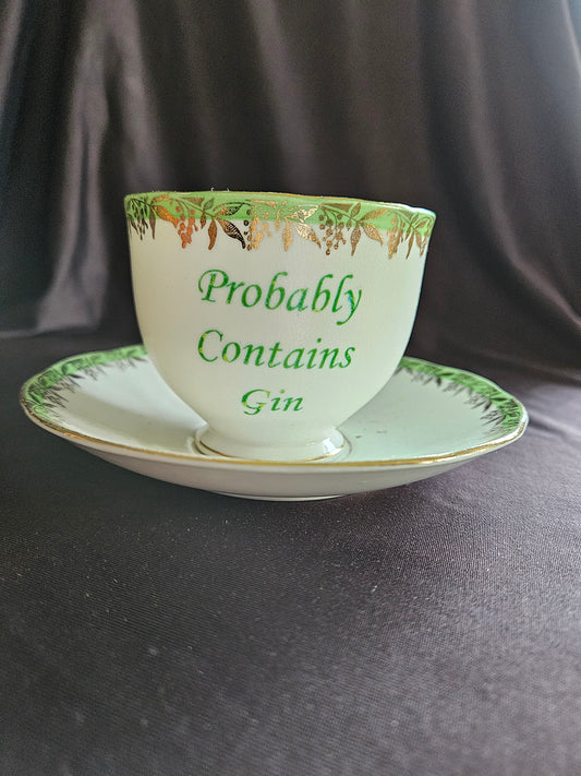 Probably contains Gin teacup and saucer